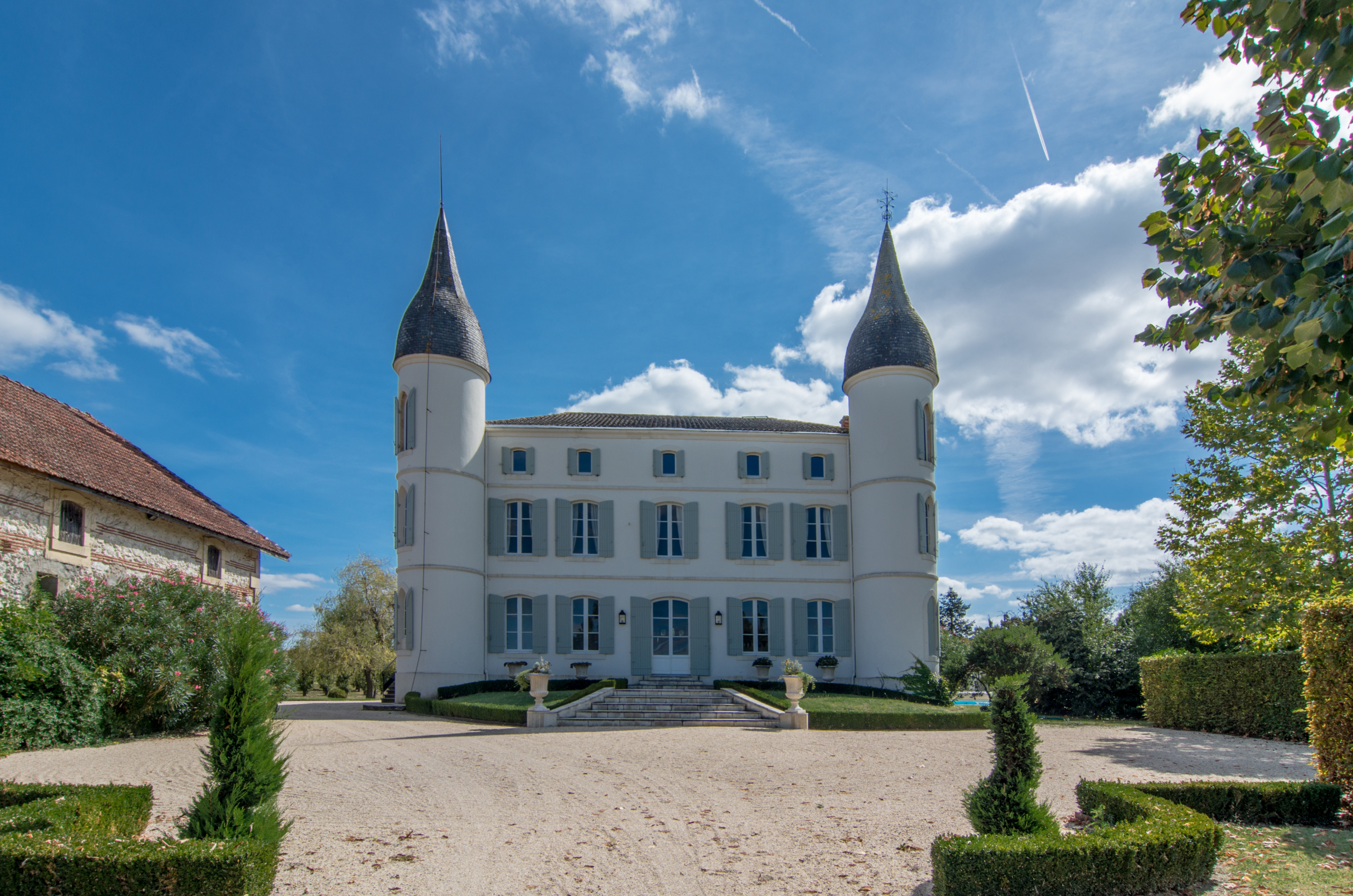 Front view of white fairytale chateau with two towers