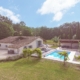 Beautiful farmhouse retreat set in french countryside. Aerial view of the converted barn and swimming pool and gardens.
